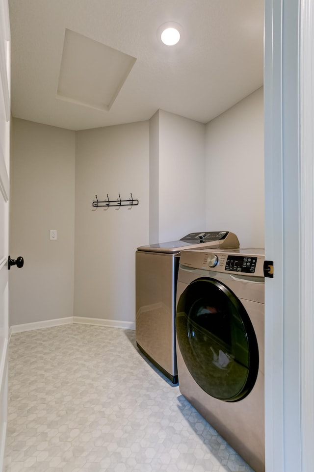 washroom featuring washing machine and dryer