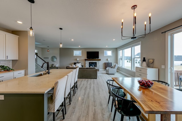 dining area featuring light hardwood / wood-style floors and sink