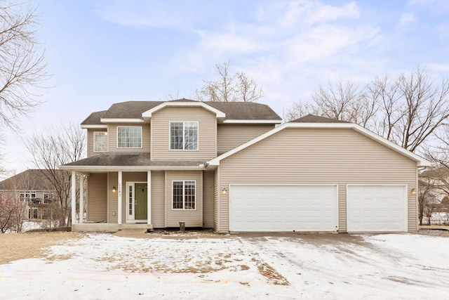 view of front of house featuring a garage and a porch