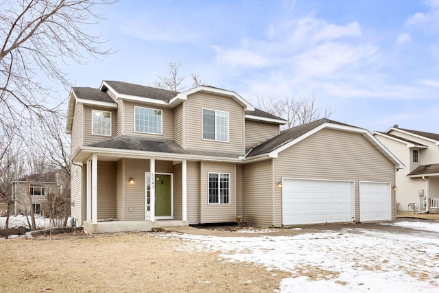 view of front of house featuring a garage and a porch