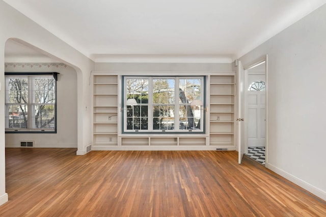 unfurnished living room with hardwood / wood-style floors