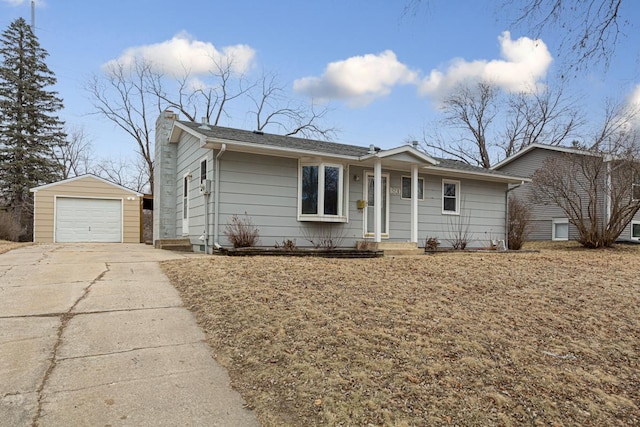 single story home with a garage and an outbuilding