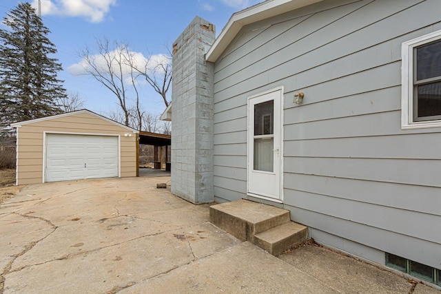 view of side of property featuring a garage and an outdoor structure