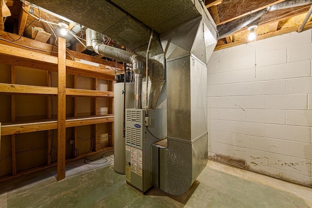 utility room featuring water heater and heating unit