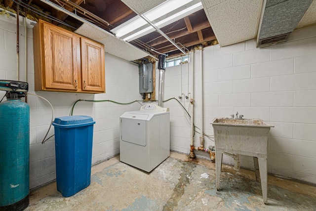 washroom featuring cabinets, electric panel, and washer / dryer