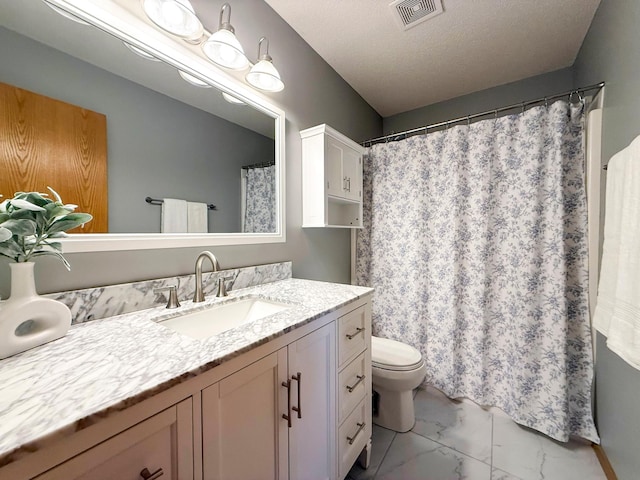 full bathroom with visible vents, toilet, vanity, marble finish floor, and a textured ceiling