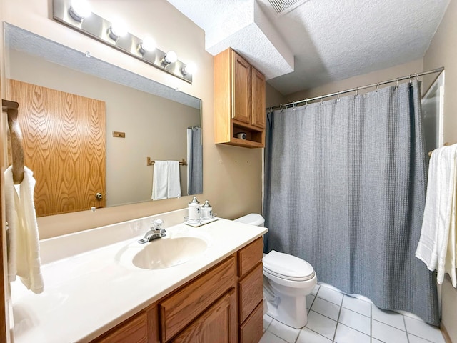 full bath with vanity, visible vents, a textured ceiling, tile patterned floors, and toilet