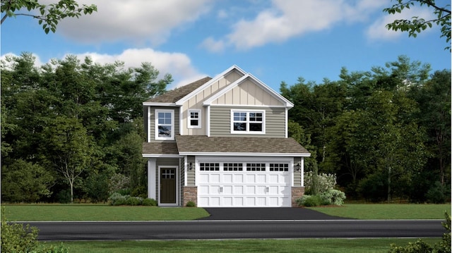 view of front of property with a garage and a front yard