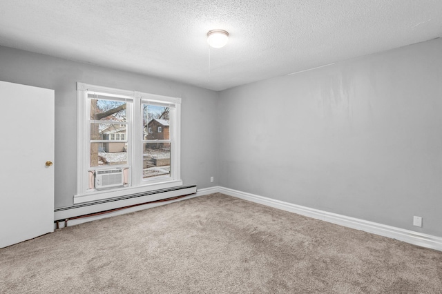 empty room with cooling unit, a baseboard radiator, carpet flooring, and a textured ceiling