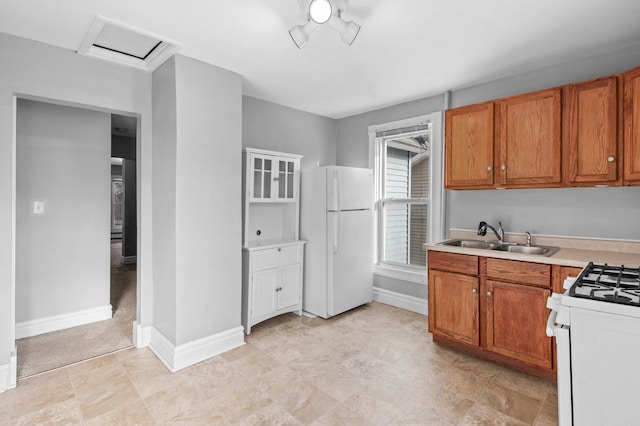 kitchen featuring sink and white appliances