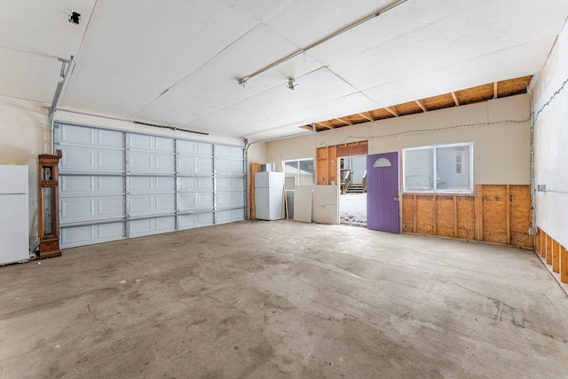 garage with white fridge