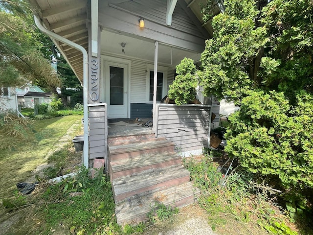 property entrance featuring covered porch