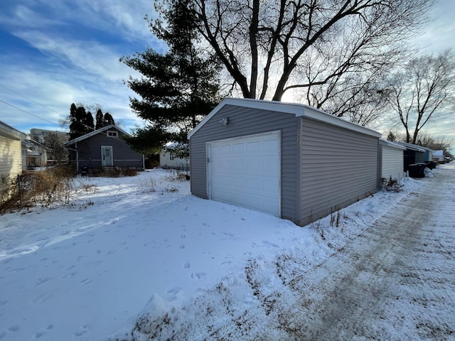 view of snow covered garage