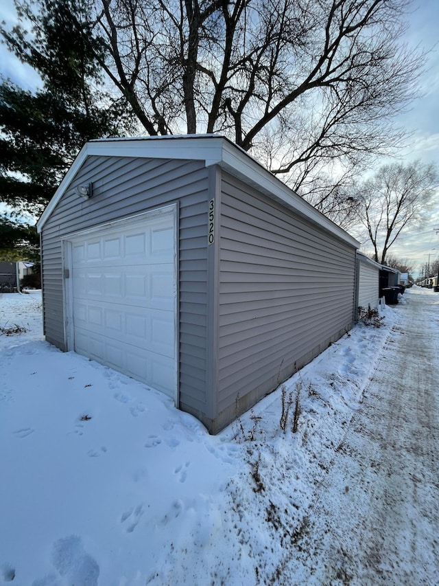 view of snow covered garage