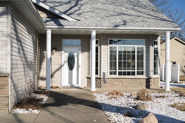 view of snow covered property entrance