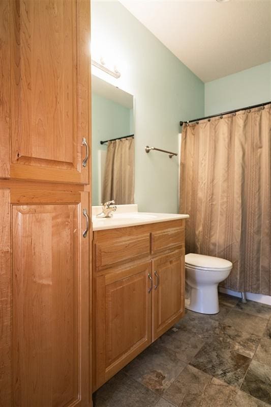 bathroom with vanity and toilet