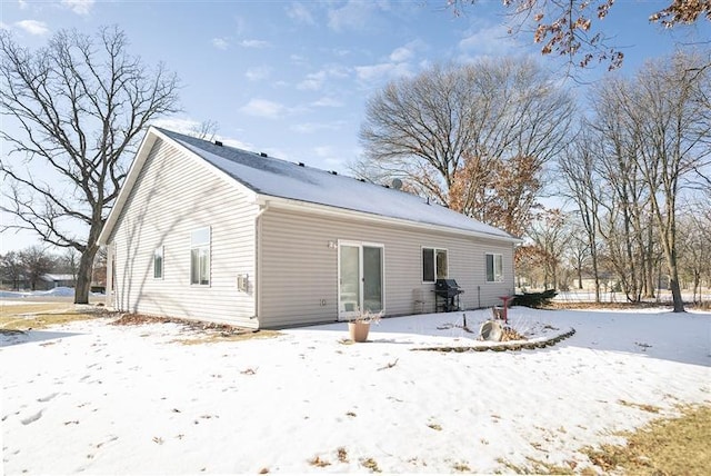 view of snow covered house