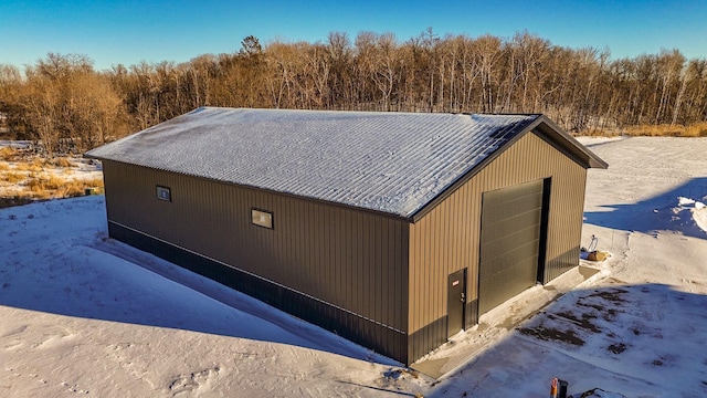 view of home's exterior with an outbuilding and a garage