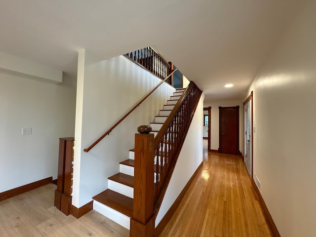 stairs with wood-type flooring