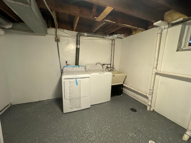 washroom with sink and washer and clothes dryer