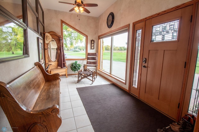 sunroom featuring ceiling fan