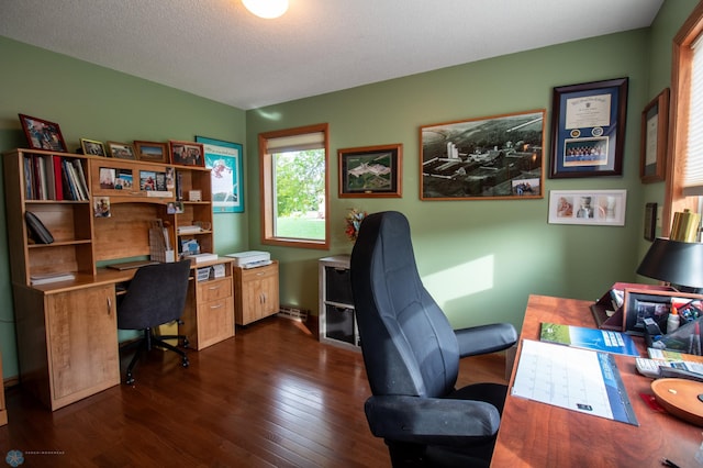 office with dark wood-type flooring and a textured ceiling