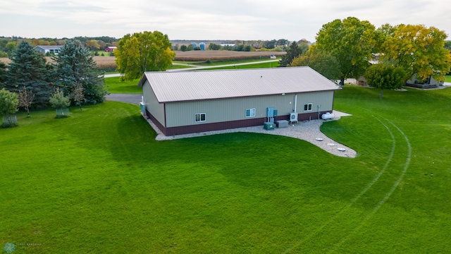 birds eye view of property with a rural view