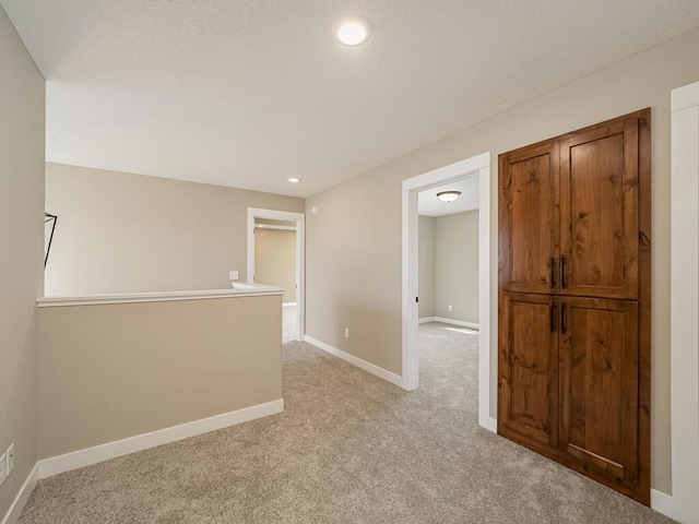 empty room with light colored carpet