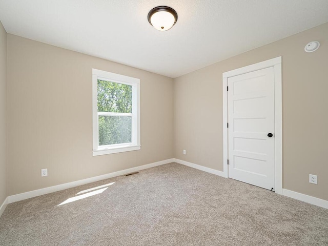 view of carpeted spare room