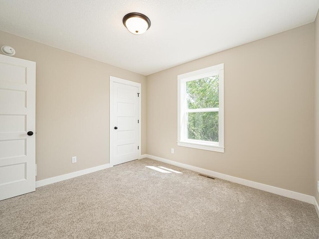 view of carpeted spare room