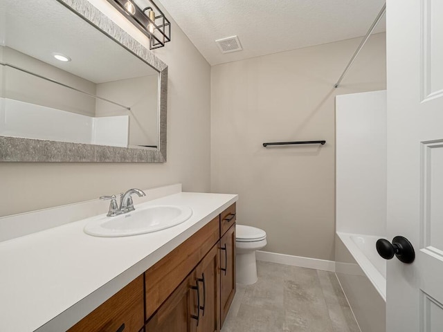 full bathroom featuring vanity, toilet, shower / bathing tub combination, and a textured ceiling