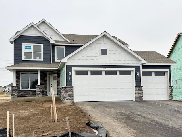 craftsman house featuring a garage and a porch