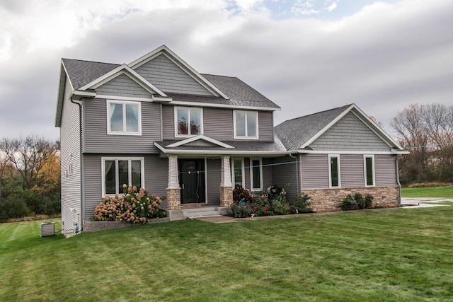 craftsman-style home with a front lawn