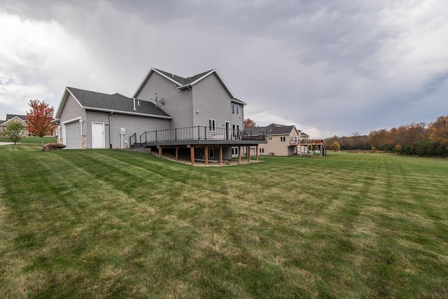 view of yard featuring a garage and a deck