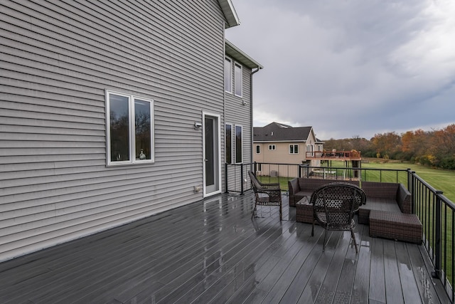 wooden terrace featuring outdoor lounge area