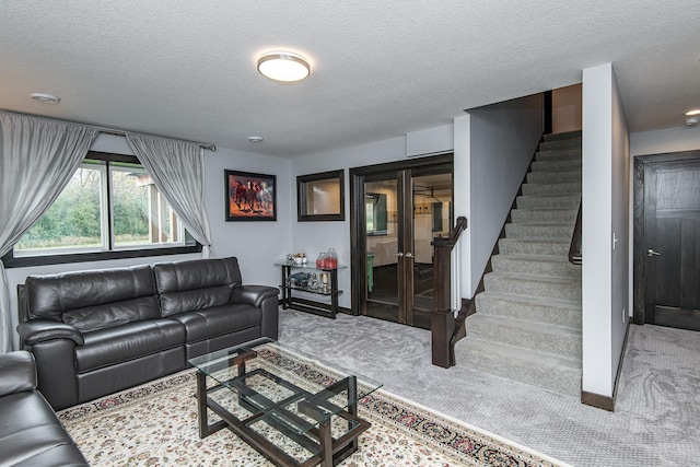 carpeted living room with a textured ceiling