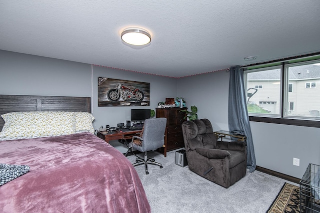 carpeted bedroom with a textured ceiling