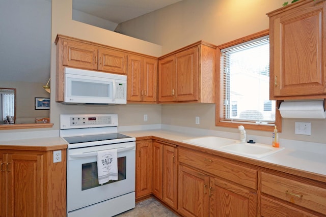 kitchen with sink and white appliances