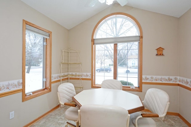 dining room with lofted ceiling