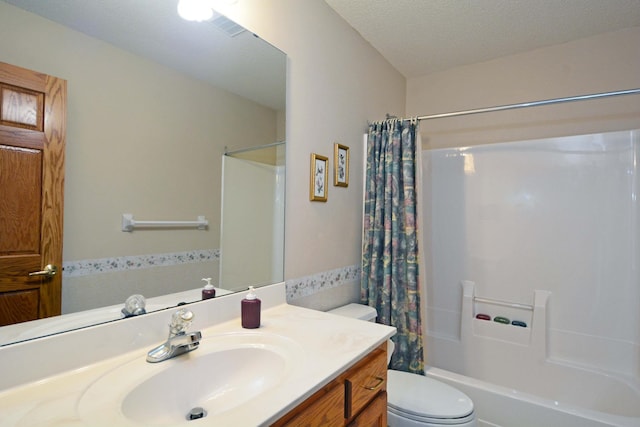 full bathroom featuring vanity, a textured ceiling, toilet, and shower / tub combo with curtain