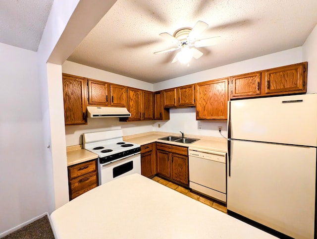 kitchen featuring ceiling fan, sink, a textured ceiling, and white appliances