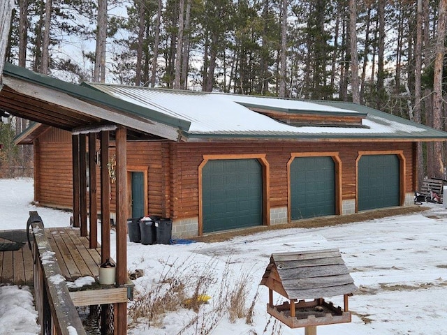 view of snow covered garage