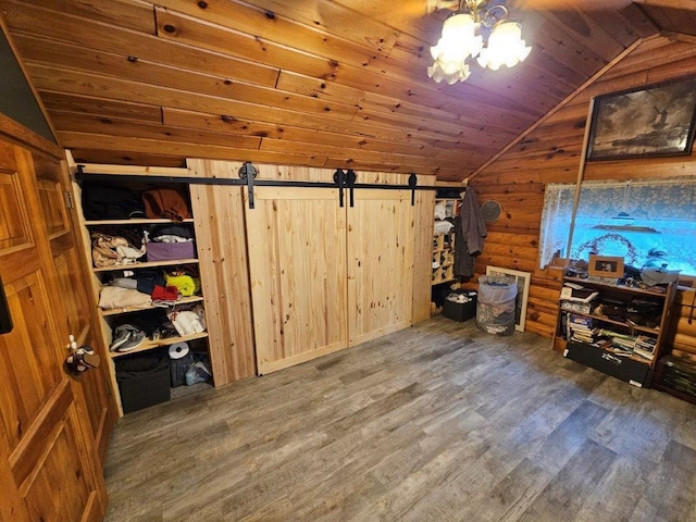 interior space featuring dark wood-type flooring, log walls, and wood ceiling