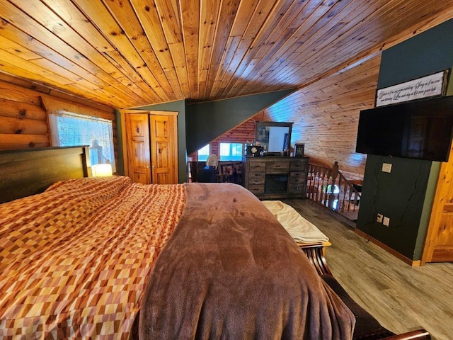 bedroom featuring wood ceiling, rustic walls, vaulted ceiling, and multiple windows