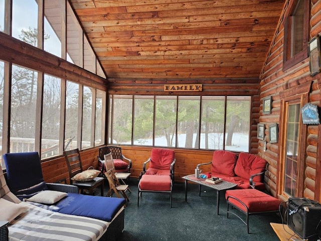 sunroom / solarium featuring lofted ceiling and wood ceiling