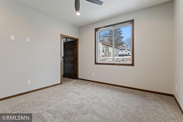 carpeted spare room with recessed lighting, ceiling fan, and baseboards