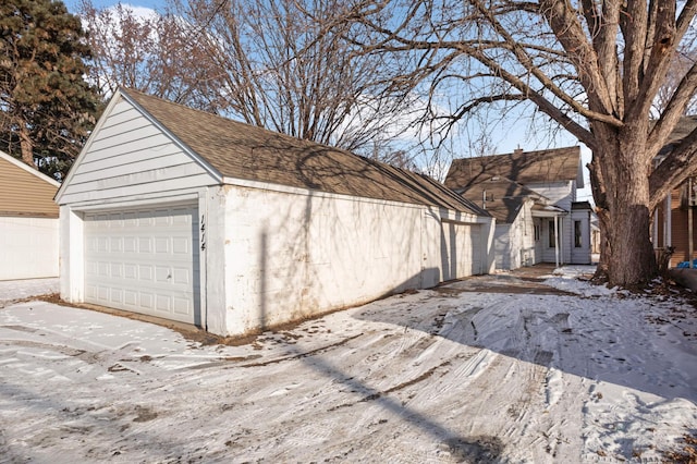 view of snow covered garage