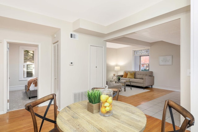 dining area with light hardwood / wood-style flooring