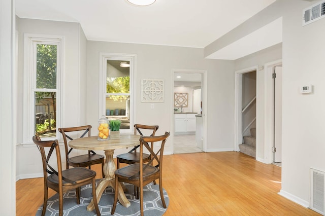 dining area with light wood-type flooring