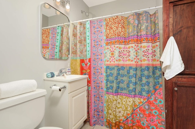 bathroom with vanity, a shower with curtain, and toilet